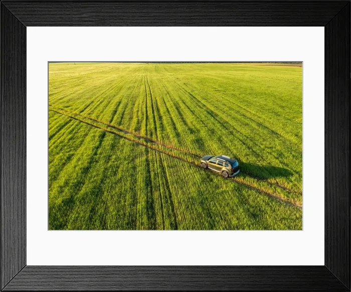 Framed Print : Aerial view of car SUV parked near countryside road in field rural landscape. Bird's-eye drone view of car SUV parked near countryside road in summer Framed Print : Aerial view of car SUV parked near countryside road in field rural landscape. Bird's-eye drone view of car SUV parked near countryside road in summer