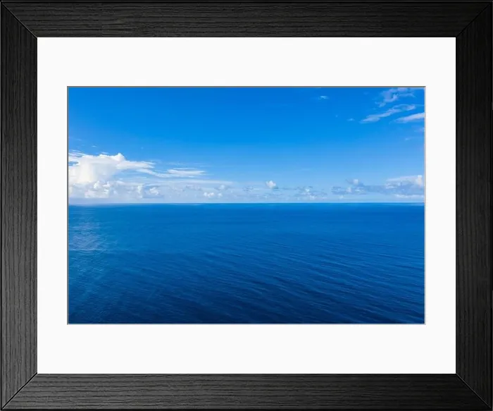Framed Print : Seascape with sea horizon and almost clear deep blue sky background. Perfect sky and water, endless ocean view, blue color. Soft waves, surf concept Framed Print : Seascape with sea horizon and almost clear deep blue sky background. Perfect sky and water, endless ocean view, blue color. Soft waves, surf concept