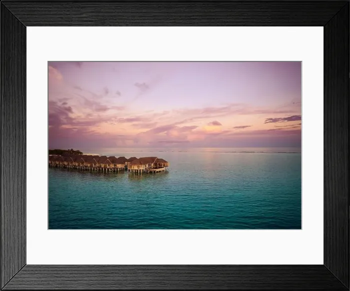 Framed Print : Drone photo wooden water villas seen from above and an amazing blue lagoon crystal clear water close to tropical lagoon. Amazing summer