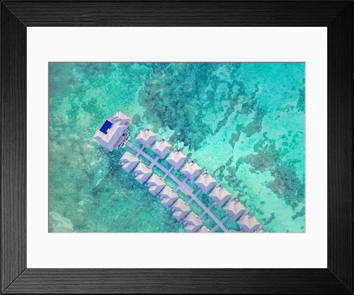Framed Print : Amazing bird eyes view in Maldives, landscape seascape aerial view over a Maldives. Landscape, luxury tropical resort or hotel with water villas beach Framed Print : Amazing bird eyes view in Maldives, landscape seascape aerial view over a Maldives. Landscape, luxury tropical resort or hotel with water villas beach