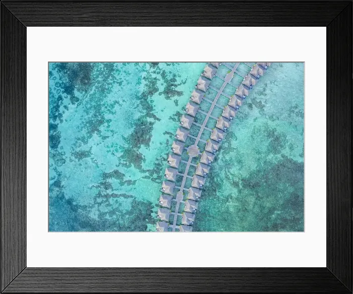Framed Print : Amazing bird eyes view in Maldives, landscape seascape aerial view over a Maldives. Landscape, luxury tropical resort or hotel with water villas beach Framed Print : Amazing bird eyes view in Maldives, landscape seascape aerial view over a Maldives. Landscape, luxury tropical resort or hotel with water villas beach