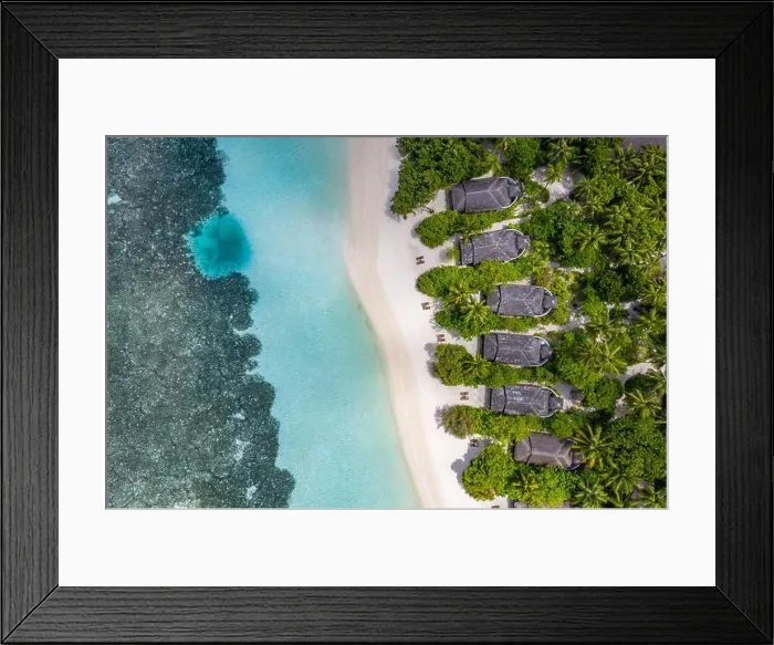Framed Print : Aerial view on Maldives island. Luxury tropical resort or hotel with beach villas and beautiful beach scenery, coral reef and white sandy landscape Framed Print : Aerial view on Maldives island. Luxury tropical resort or hotel with beach villas and beautiful beach scenery, coral reef and white sandy landscape
