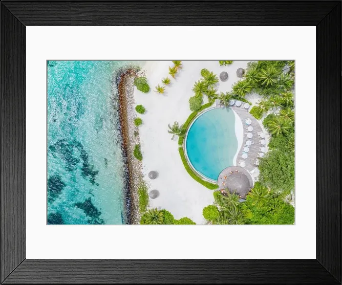 Framed Print : Top view from drone at beach, azure sea and poolside with palm tree in Maldives luxury resort. Tropical island, exotic aerial landscape Framed Print : Top view from drone at beach, azure sea and poolside with palm tree in Maldives luxury resort. Tropical island, exotic aerial landscape