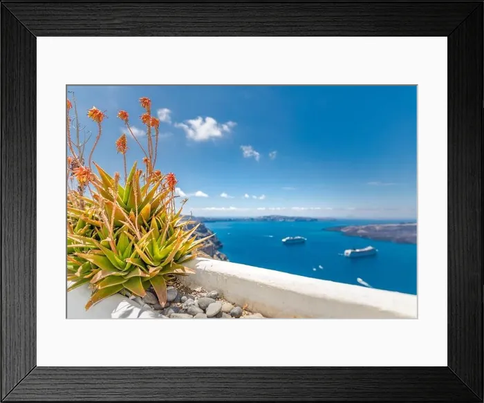 Framed Print : Peaceful view in Santorini, Greece with white architecture and pink flowers, cruise ships, Mediterranean summer mood, vacation and travel background Framed Print : Peaceful view in Santorini, Greece with white architecture and pink flowers, cruise ships, Mediterranean summer mood, vacation and travel background
