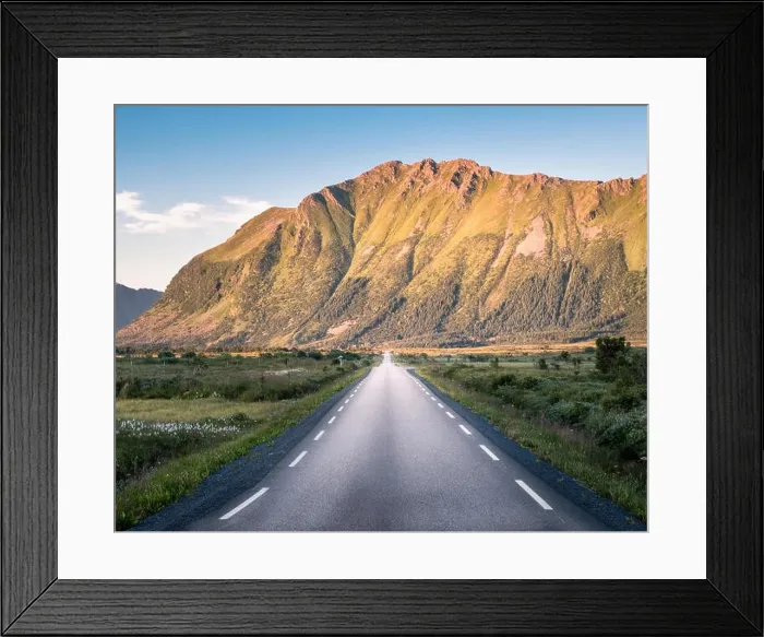 Framed Print : Straight asphalt road with mountain landscape against blue sky in Lofoten, Norway Framed Print : Straight asphalt road with mountain landscape against blue sky in Lofoten, Norway