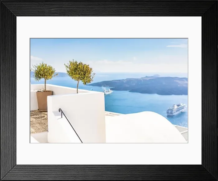 Framed Print : White wash staircases on Santorini Island, Greece. The view toward Caldera sea with cruise ship awaiting. Luxury summer travel, dream vacation Framed Print : White wash staircases on Santorini Island, Greece. The view toward Caldera sea with cruise ship awaiting. Luxury summer travel, dream vacation