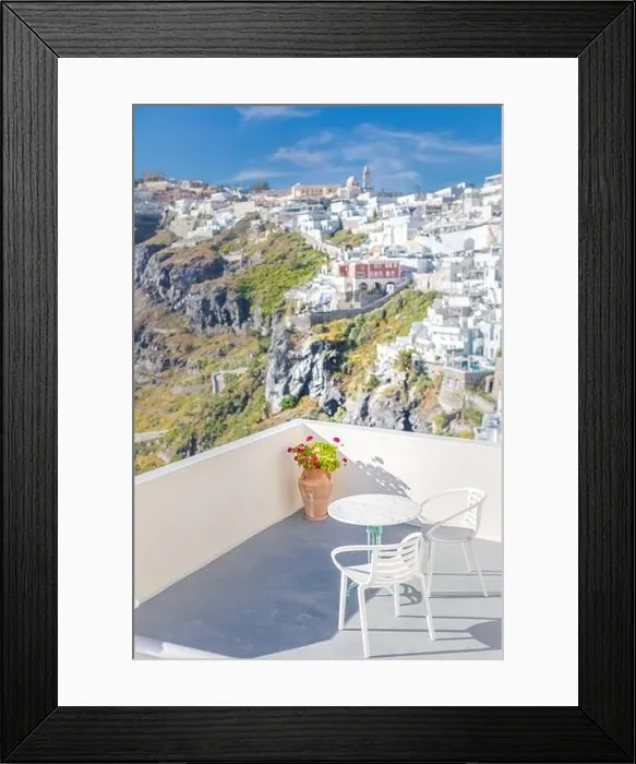 Framed Print : Romantic two chairs and a table on the terrace, Santorini island Greece. Summer vibes with white architecture and sea view. Luxury travel background Framed Print : Romantic two chairs and a table on the terrace, Santorini island Greece. Summer vibes with white architecture and sea view. Luxury travel background
