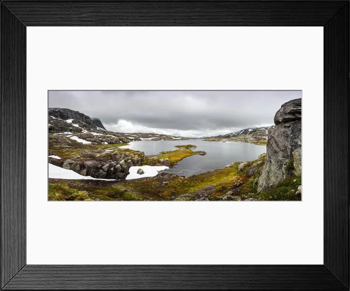 Framed Print : Typical norwegian landscape with snowy mountains and clear lake near the Trolltunga rock - most spectacular and famous scenic cliff in Norway Framed Print : Typical norwegian landscape with snowy mountains and clear lake near the Trolltunga rock - most spectacular and famous scenic cliff in Norway