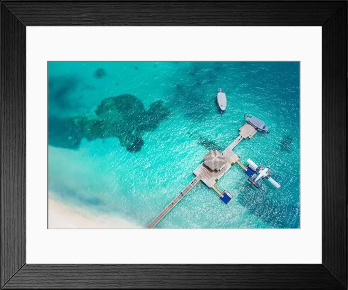 Framed Print : Aerial view of beach in Maldives. Amazing aerial landscape in Maldives islands, blue sea and coral reef view from drone or plane. Exotic summer travel Framed Print : Aerial view of beach in Maldives. Amazing aerial landscape in Maldives islands, blue sea and coral reef view from drone or plane. Exotic summer travel