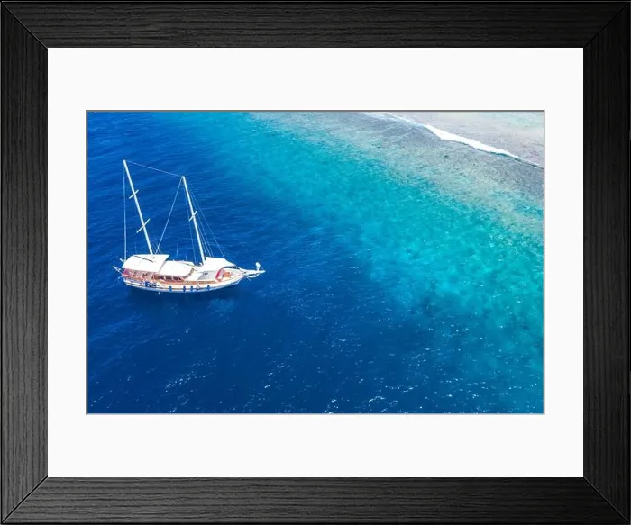 Framed Print : Beautiful turquoise ocean water boat top view aerial photo. Aerial view speed boat in the sea. Exotic sea lagoon, snorkel adventure, tropical ocean Framed Print : Beautiful turquoise ocean water boat top view aerial photo. Aerial view speed boat in the sea. Exotic sea lagoon, snorkel adventure, tropical ocean