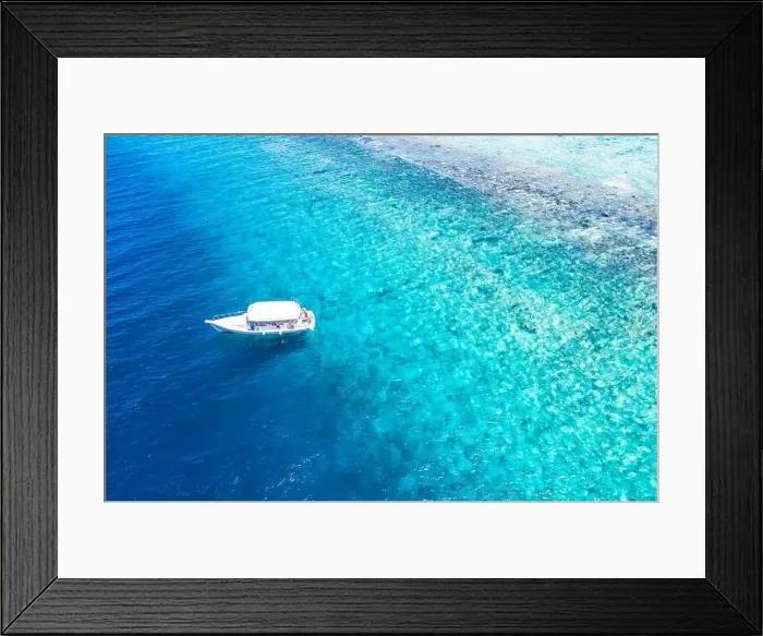 Framed Print : Beautiful turquoise ocean water boat top view aerial photo. Aerial view speed boat in the sea. Exotic sea lagoon, snorkel adventure, tropical ocean Framed Print : Beautiful turquoise ocean water boat top view aerial photo. Aerial view speed boat in the sea. Exotic sea lagoon, snorkel adventure, tropical ocean