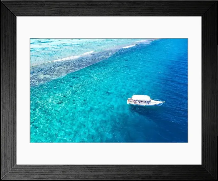 Framed Print : Beautiful turquoise ocean water boat top view aerial photo. Aerial view speed boat in the sea. Exotic sea lagoon, snorkel adventure, tropical ocean Framed Print : Beautiful turquoise ocean water boat top view aerial photo. Aerial view speed boat in the sea. Exotic sea lagoon, snorkel adventure, tropical ocean