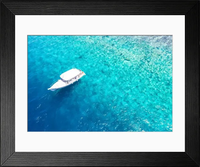 Framed Print : Beautiful turquoise ocean water boat top view aerial photo. Aerial view speed boat in the sea. Exotic sea lagoon, snorkel adventure, tropical ocean Framed Print : Beautiful turquoise ocean water boat top view aerial photo. Aerial view speed boat in the sea. Exotic sea lagoon, snorkel adventure, tropical ocean
