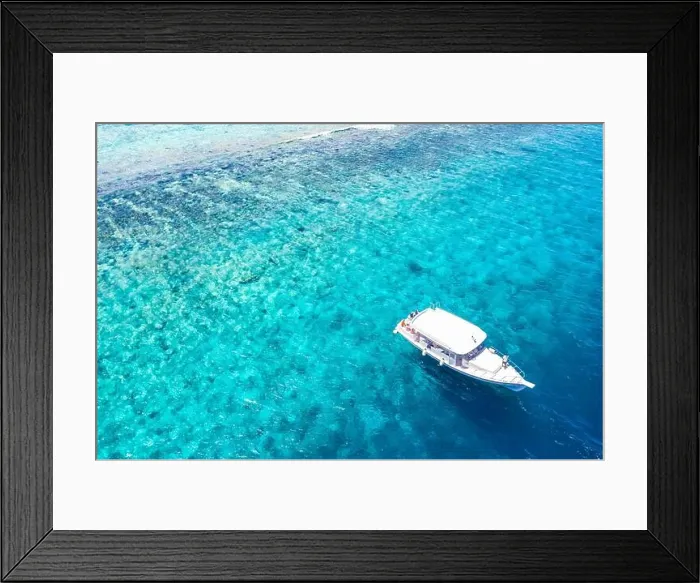Framed Print : Beautiful turquoise ocean water boat top view aerial photo. Aerial view speed boat in the sea. Exotic sea lagoon, snorkel adventure, tropical ocean Framed Print : Beautiful turquoise ocean water boat top view aerial photo. Aerial view speed boat in the sea. Exotic sea lagoon, snorkel adventure, tropical ocean