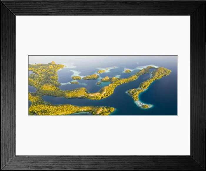 Framed Print : An aerial view of islands in Raja Ampat. This area is the heart of marine biodiversity and is a popular destination for scuba divers and snorkelers Framed Print : An aerial view of islands in Raja Ampat. This area is the heart of marine biodiversity and is a popular destination for scuba divers and snorkelers