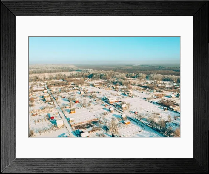 Framed Print : Aerial view of snow-covered vegetable gardens in country village. Skyline in winter day. Bird's-eye view oof small town, village cityscape skyline in Framed Print : Aerial view of snow-covered vegetable gardens in country village. Skyline in winter day. Bird's-eye view oof small town, village cityscape skyline in