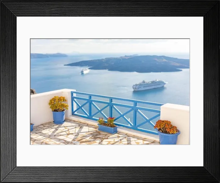 Framed Print : Peaceful view in Santorini, Greece with white architecture and flowers, cruise ships, Mediterranean summer mood, vacation and travel background Framed Print : Peaceful view in Santorini, Greece with white architecture and flowers, cruise ships, Mediterranean summer mood, vacation and travel background