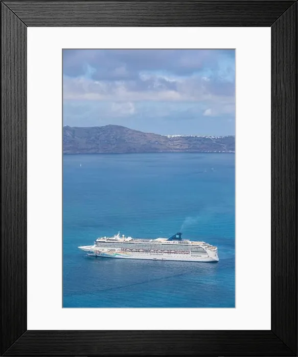 Framed Print : 10.05.19. - Santorini, Greece: Norwegian Jade cruise ship in Santorini sea bay, Blue water with volcanic cliffs over the horizon. Luxury cruiser Fira Framed Print : 10.05.19. - Santorini, Greece: Norwegian Jade cruise ship in Santorini sea bay, Blue water with volcanic cliffs over the horizon. Luxury cruiser Fira