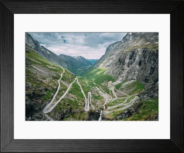 Framed Print : Trollstigen, Andalsnes, Norway. Cars Goes On Serpentine Mountain Road Trollstigen. Famous Norwegian Landmark And Popular Destination. Norwegian County Framed Print : Trollstigen, Andalsnes, Norway. Cars Goes On Serpentine Mountain Road Trollstigen. Famous Norwegian Landmark And Popular Destination. Norwegian County