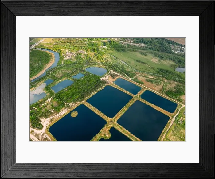 Framed Print : Aerial View Retention Basins, Wet Pond, Wet Detention Basin Or Stormwater Management Pond, Is An Artificial Pond With Vegetation Around The Perimeter Framed Print : Aerial View Retention Basins, Wet Pond, Wet Detention Basin Or Stormwater Management Pond, Is An Artificial Pond With Vegetation Around The Perimeter