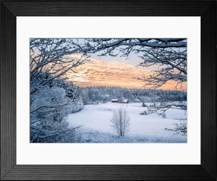 Framed Print : Scenic winter landscapw with farm house and sunset at evening light in Finland Framed Print : Scenic winter landscapw with farm house and sunset at evening light in Finland