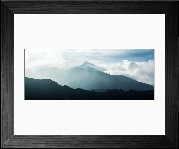 Framed Print : Panorama of beauty blue foggy mountains range. Cloudy sky and dark mountain peaks with glowing mist. Landscape photography Framed Print : Panorama of beauty blue foggy mountains range. Cloudy sky and dark mountain peaks with glowing mist. Landscape photography