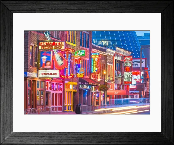 Framed Print : NASHVILLE, TENNESSEE - AUGUST 20, 2018: Honky-tonks on Lower Broadway. The district is famous for the numerous country music entertainment establishme Framed Print : NASHVILLE, TENNESSEE - AUGUST 20, 2018: Honky-tonks on Lower Broadway. The district is famous for the numerous country music entertainment establishme