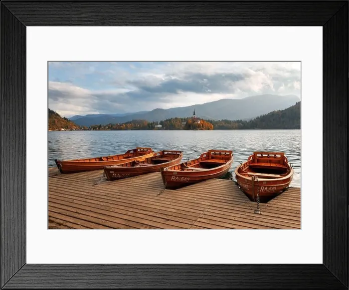 Framed Print : Amazing autumn view of Bled lake in Julian Alps, Slovenia. Wooden boat on city pier. Pilgrimage church of the Assumption of Maria on a foreground Framed Print : Amazing autumn view of Bled lake in Julian Alps, Slovenia. Wooden boat on city pier. Pilgrimage church of the Assumption of Maria on a foreground