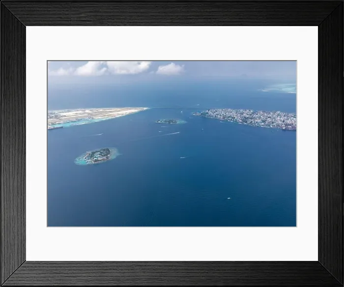 Framed Print : The capital of Maldives from the sky. Aerial view on male the capital city of maldives. overcrowded island in the indian ocean blue ocean sea