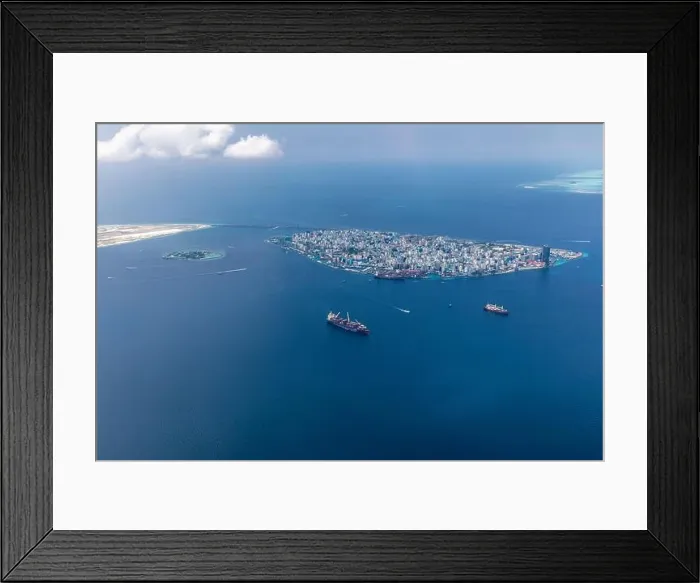 Framed Print : The capital of Maldives from the sky. Aerial view on male the capital city of maldives. overcrowded island in the indian ocean blue ocean sea