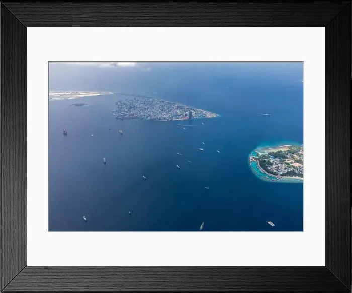 Framed Print : The capital of Maldives from the sky. Aerial view on male the capital city of maldives. overcrowded island in the indian ocean blue ocean sea Framed Print : The capital of Maldives from the sky. Aerial view on male the capital city of maldives. overcrowded island in the indian ocean blue ocean sea