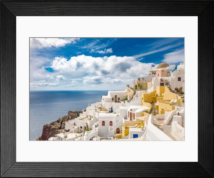 Framed Print : Summer travel destinations. Picturesque cityscape of Oia village in Santorini island located volcanic caldera. Traditional windmills, luxury vacation