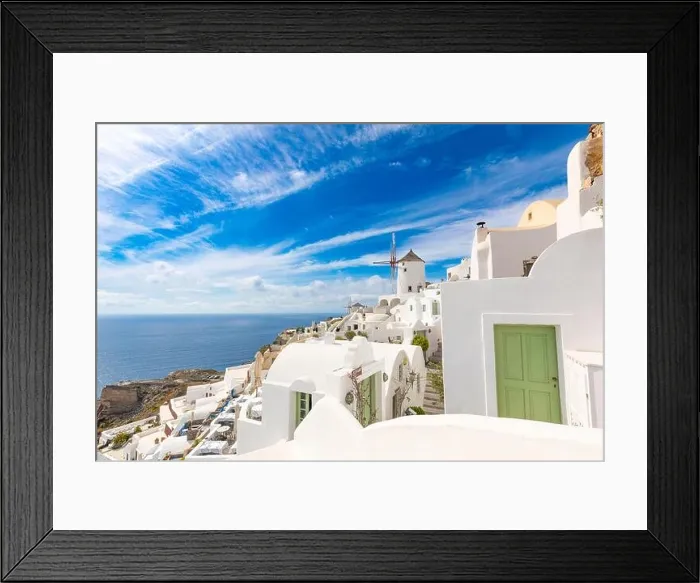 Framed Print : Summer travel destinations. Picturesque cityscape of Oia village in Santorini island located volcanic caldera. Traditional windmills, luxury vacation