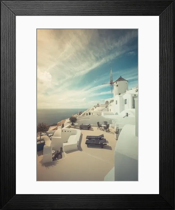 Framed Print : Summer travel destinations. Picturesque cityscape of Oia village in Santorini island located volcanic caldera. Traditional windmills, luxury vacation Framed Print : Summer travel destinations. Picturesque cityscape of Oia village in Santorini island located volcanic caldera. Traditional windmills, luxury vacation