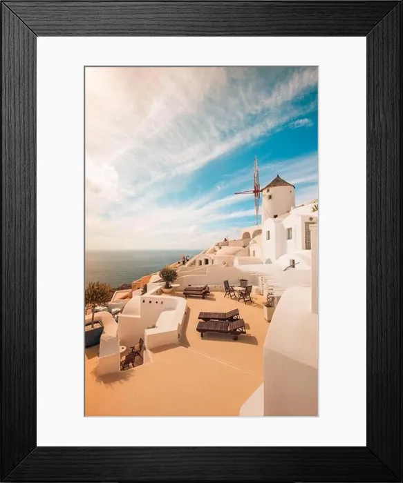 Framed Print : View of Oia the most beautiful village of Santorini Island in Greece. Idyllic summer travel landscape, holiday. Romantic chaise lounge couple vacation Framed Print : View of Oia the most beautiful village of Santorini Island in Greece. Idyllic summer travel landscape, holiday. Romantic chaise lounge couple vacation