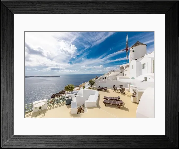 Framed Print : Summer travel destinations. Picturesque cityscape of Oia village in Santorini island located volcanic caldera. Traditional windmills, luxury vacation Framed Print : Summer travel destinations. Picturesque cityscape of Oia village in Santorini island located volcanic caldera. Traditional windmills, luxury vacation