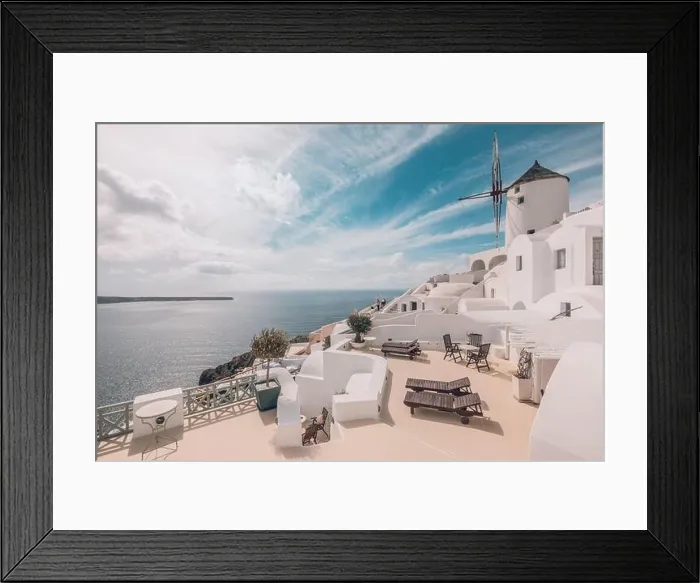 Framed Print : Summer travel destinations. Picturesque cityscape of Oia village in Santorini island located volcanic caldera. Traditional windmills, luxury vacation Framed Print : Summer travel destinations. Picturesque cityscape of Oia village in Santorini island located volcanic caldera. Traditional windmills, luxury vacation