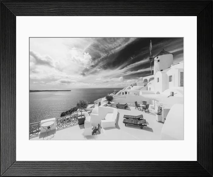Framed Print : Black and white image of white architecture in Santorini Oia, Greece. Monochrome travel landscape. Dramatic process, Aegean sea in black and white