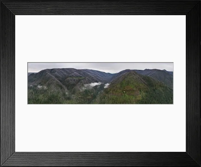 Framed Print : Low clouds drift in a mountainous valley in the Columbia River Gorge, Oregon. This area is known for its waterfalls, forests and the Columbia River Framed Print : Low clouds drift in a mountainous valley in the Columbia River Gorge, Oregon. This area is known for its waterfalls, forests and the Columbia River