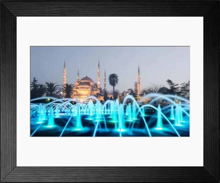 Framed Print : Fountain on Sultanahmet area in evening time. Multicolored streams against the background of the Blue mosque. Located place: Istambul, Turkey Framed Print : Fountain on Sultanahmet area in evening time. Multicolored streams against the background of the Blue mosque. Located place: Istambul, Turkey