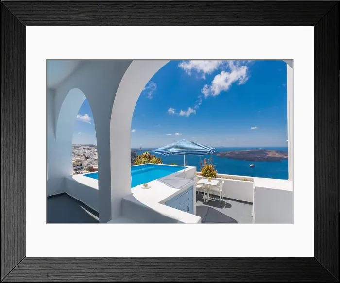 Framed Print : Luxury Greek holidays in Santorini. White architecture, chairs over sea view and umbrella with empty infinity pool Santorini. Summer vacation, holiday Framed Print : Luxury Greek holidays in Santorini. White architecture, chairs over sea view and umbrella with empty infinity pool Santorini. Summer vacation, holiday