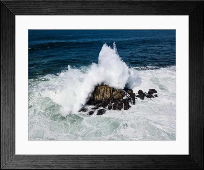 Framed Print : Powerful swells from the Pacific Ocean crash against the rocks just off the coastline of the Monterey peninsula in California