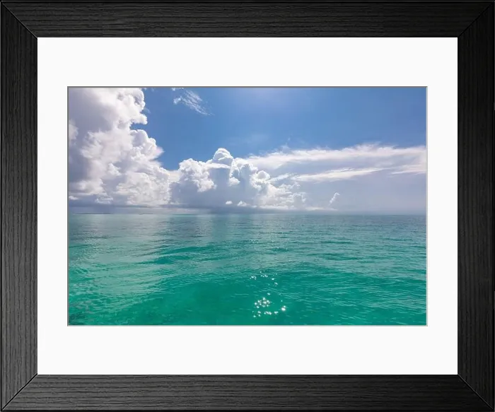 Framed Print : Scenic summer view of the blue tropical sea or ocean resort and sky with clouds. Beautiful ocean beach Framed Print : Scenic summer view of the blue tropical sea or ocean resort and sky with clouds. Beautiful ocean beach