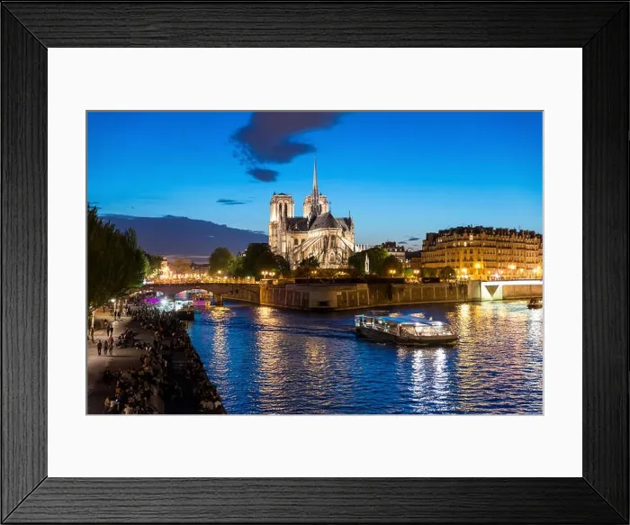 Framed Print : Notre Dame de Paris with cruise ship on Seine river at night in Paris, France Framed Print : Notre Dame de Paris with cruise ship on Seine river at night in Paris, France