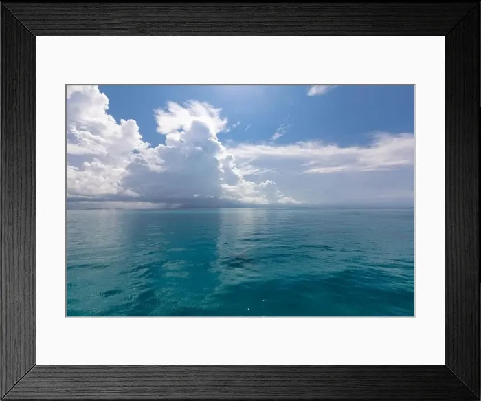 Framed Print : Scenic summer view of the blue tropical sea or ocean resort and sky with clouds. Beautiful ocean beach Framed Print : Scenic summer view of the blue tropical sea or ocean resort and sky with clouds. Beautiful ocean beach