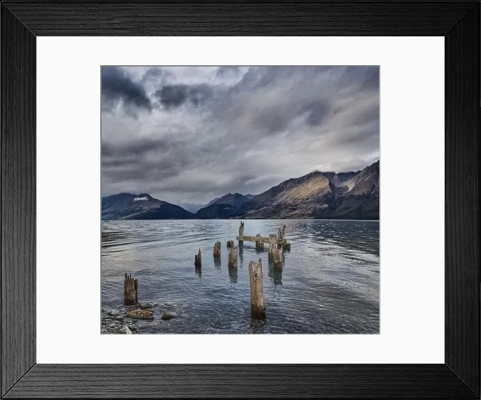 Framed Print : Mountain lake with remains of old wooden pier at windy cloudy morning Framed Print : Mountain lake with remains of old wooden pier at windy cloudy morning