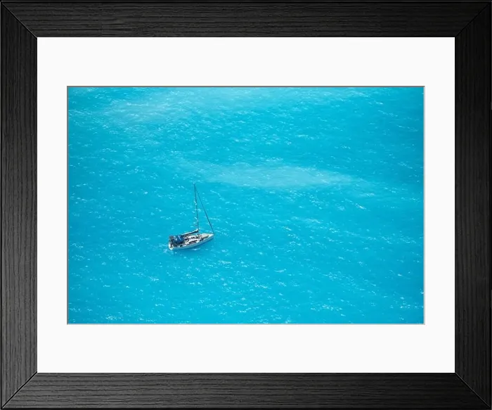 Framed Print : Aerial view over a boat on turquoise sea water, in sunny summer day in Ioniam Sea, Greece Framed Print : Aerial view over a boat on turquoise sea water, in sunny summer day in Ioniam Sea, Greece