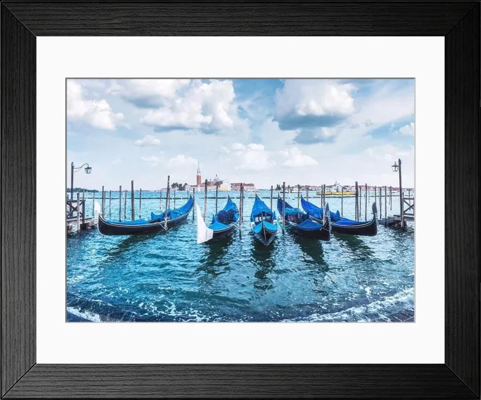 Framed Print : Colorful landscape with clear blue sky on piazza San Marco in Venice. Row of gondolas parked on city pier Framed Print : Colorful landscape with clear blue sky on piazza San Marco in Venice. Row of gondolas parked on city pier