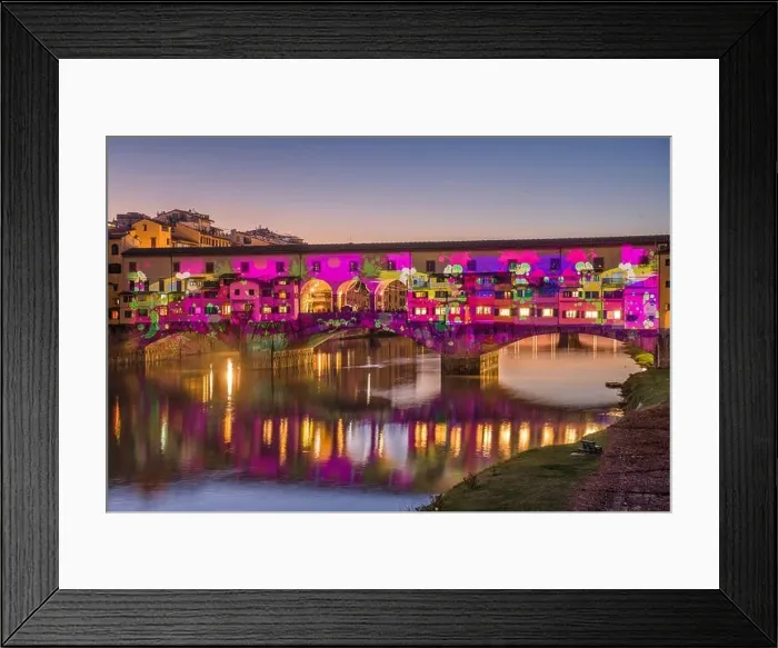 Framed Print : Florence, Italy at the Ponte Vecchio Bridge crossing the Arno River at twilight with holiday illumination Framed Print : Florence, Italy at the Ponte Vecchio Bridge crossing the Arno River at twilight with holiday illumination