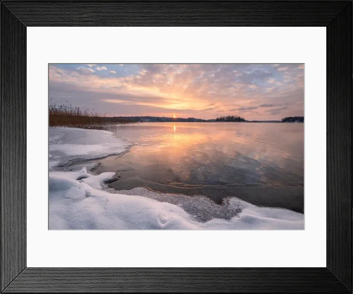Framed Print : Scenic winter landscape with frozen lake and sunset at evening time in Finland Framed Print : Scenic winter landscape with frozen lake and sunset at evening time in Finland